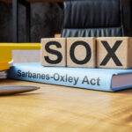 Cubes and book about SOX Sarbanes-Oxley Act.
